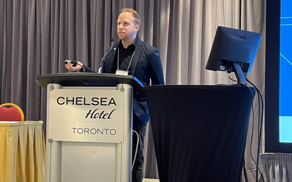 Jamie Boisvenue presenting at a podium